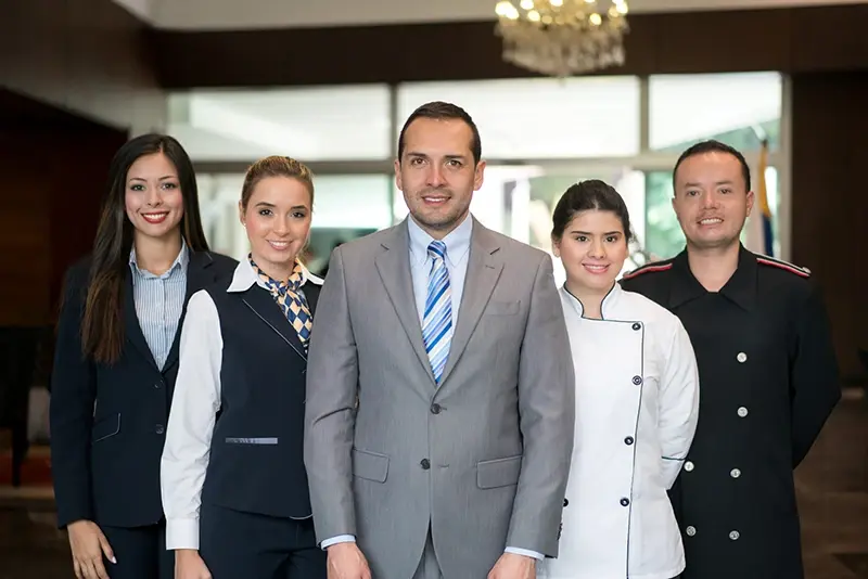 Diverse hotel staff participating in effective hospitality training.