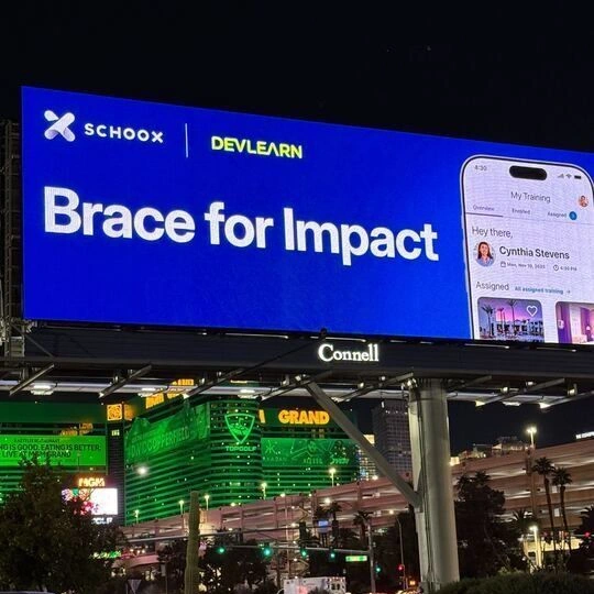 Schoox and DevLearn billboard in Las Vegas featuring the message “Brace for Impact”