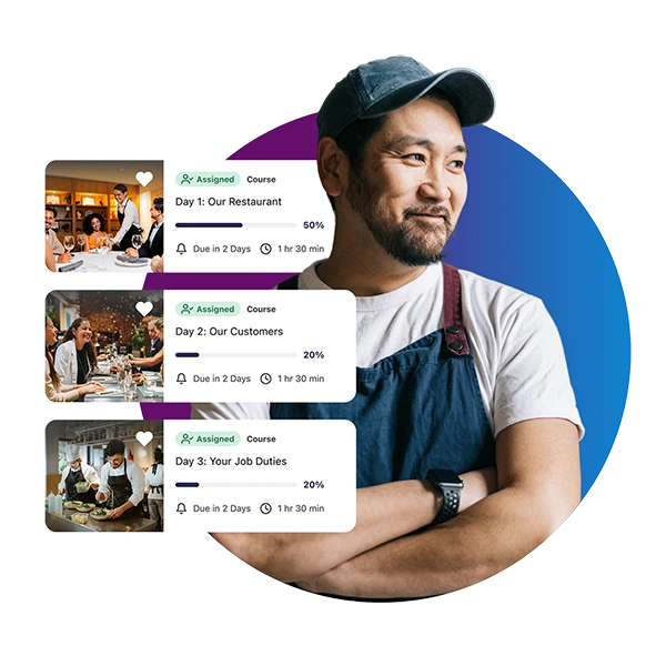 Restaurant employee wearing an apron with onboarding training courses displayed