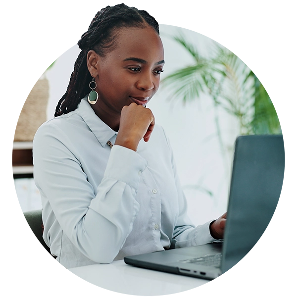 Professional working on a laptop and reviewing information