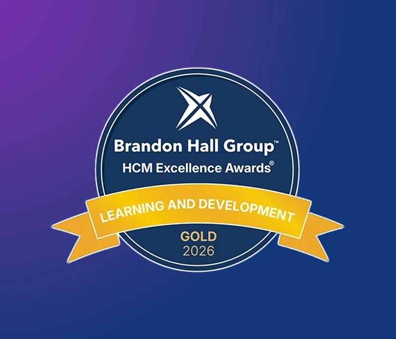 Brandon Hall Group HCM Excellence Awards badge recognizing a 2026 Gold award in Learning and Development on a purple and blue gradient background